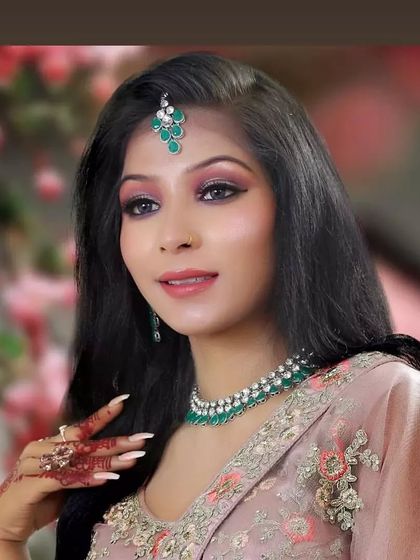 A beautiful, soft glam look perfect for a daytime event or an engagement party. The makeup features pink tones to match the outfit's embroidery.