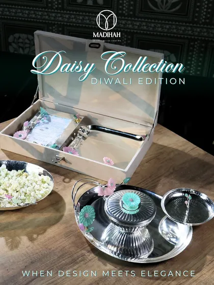 For me, Diwali is a festival of light and elegance. My Daisy Collection Diwali Edition is designed to capture that spirit. This hamper combines timeless design with festive joy, featuring silver-plated serveware and a custom keepsake box that will be cherished long after the sweets are gone.