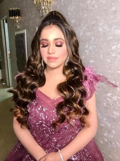 A close-up of the beautiful makeup we did for Anisha this morning. The pink shimmery eyeshadow and high ponytail create a look that is both youthful and glamorous, perfect for her engagement.