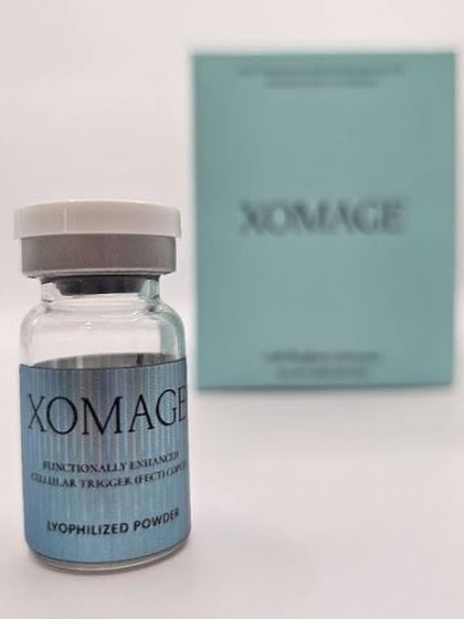 A close-up of the XOMAGE vial, which contains lyophilized (freeze-dried) powder of adipose-derived mesenchymal stem cell exosomes. This is the latest, most advanced treatment we offer for hair loss.