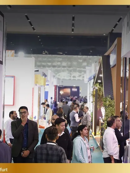 Another perspective of the crowded expo hall, demonstrating the constant flow of traffic and business interactions.