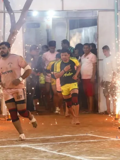 Vijay Divekar, named 'Man of the Final Day', making a grand entrance with sparklers.