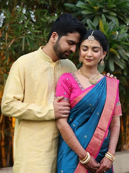 This couple's look is soft and romantic. The groom's grooming is minimal, focusing on a healthy skin look that appears natural both in person and in photographs.