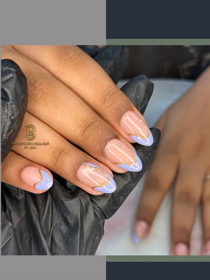 This abstract French design combines a soft lavender with a delicate gold chrome swirl. It's a modern and elegant take on nail art that is perfect for any occasion.