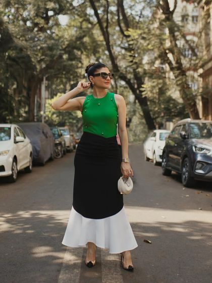 Another full-length pose, this one with a slight turn, adding a touch of movement and dynamism to the street-style look.