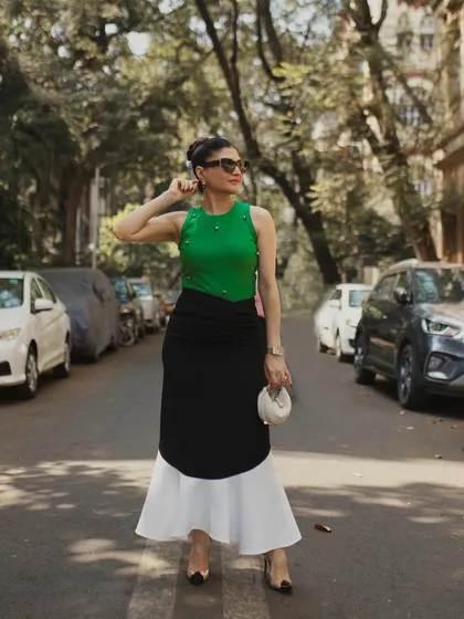 Another full-length pose, this one with a slight turn, adding a touch of movement and dynamism to the street-style look.