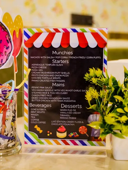 Our all-inclusive party packages feature extensive food options. This is a sample menu for a Candyland themed party, showcasing a variety of munchies, starters, main courses, and desserts, including a live chocolate fountain.