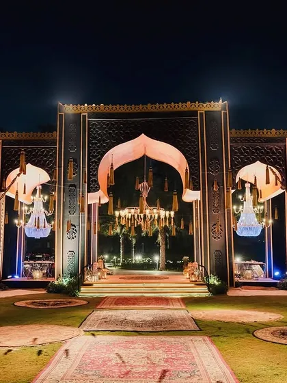 The grand entrance to an Arabian Nights themed event. I designed a massive, ornate gateway flanked by souk-style tents and illuminated by crystal chandeliers and Persian rugs, setting a magical tone from the very first step.