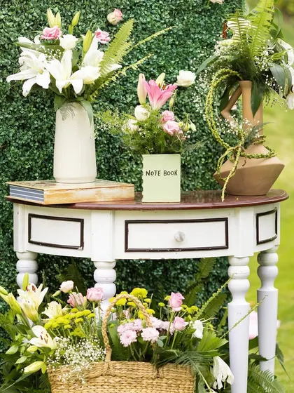 In the little details, we find the essence of a magic-filled celebration. This charming console table with fresh flowers and books created a lovely, welcoming vignette at a brunch event.