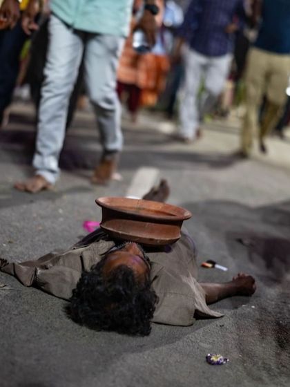 The path of devotion can take many forms. This man lies on the road in an act of extreme surrender and faith. Witnessing such moments is a humbling experience that challenges our understanding of practice and dedication.