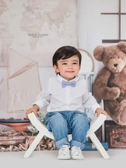 A sweet smile from our little adventurer. We create a relaxed and fun atmosphere in the studio so your child's personality can shine through.