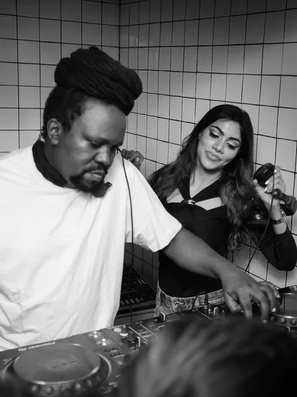 A black and white shot of me and Bobkat on the decks, celebrating 20 years of High Spirits.