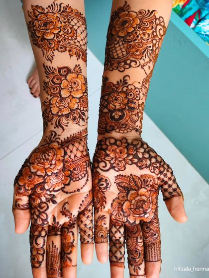 A full view of a stunning floral design, with different patterns on each hand.