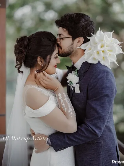 For this Christian wedding, we created a soft, romantic look with a classic updo and veil. The makeup was designed to be elegant, fresh, and last through the emotional moments of the day.