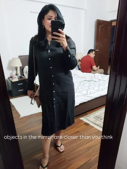 A fun mirror selfie from the evening. This also shows my husband in the reflection, a little behind-the-scenes moment from our night out.