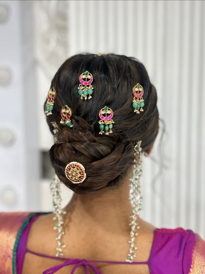 A close up of the temple jewellery on the textured bun, showing the detail of the accessories.