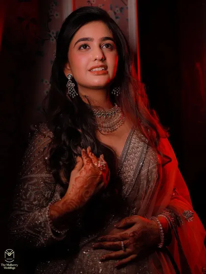 A portrait of the bride, showcasing the soft and glowing makeup look created for her engagement.