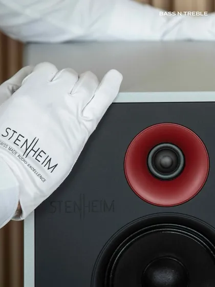The gloved touch on a Stenheim Alumine Three speaker signifies the level of precision and care that goes into Swiss-made audio excellence. Minimalist in form, monumental in sound.