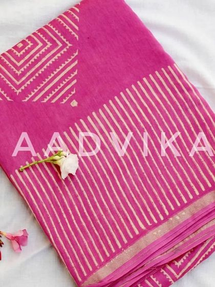 A vibrant pink silk cotton saree with a modern geometric block print. This is a fun, contemporary take on traditional handblock printing.