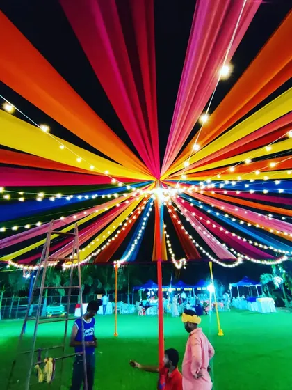 Another angle of the dandiya night canopy, showing my team ensuring all the lights and drapes are perfectly in place before the event begins.
