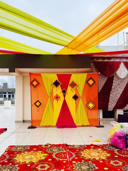 A closer view of the backdrop for the rooftop Haldi function. The bright colors look great against the open sky.
