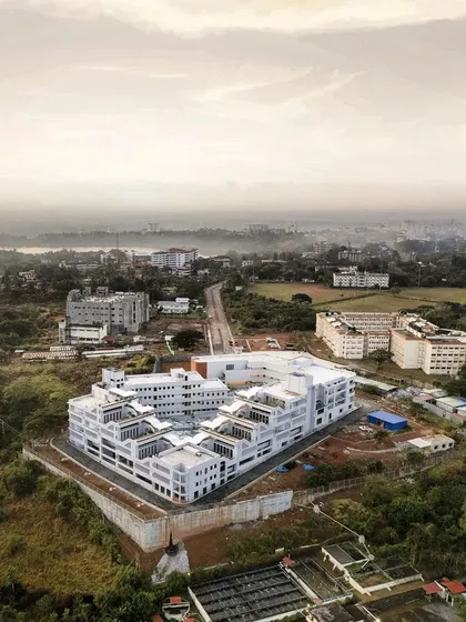 Another aerial view of MSAP, showing its relationship to the wider Manipal landscape and the valley beyond. The design strategically orients studios and rooms to capture these spectacular views.