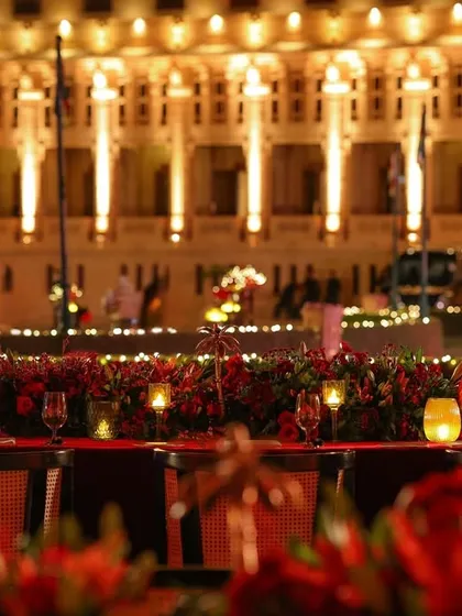 A stunning view of the dining table, with the majestic, illuminated facade of the Umaid Bhawan Palace creating a truly regal backdrop.