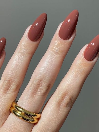 Brown is the new neutral. This rich, chocolatey brown shade is sophisticated and on-trend. Shown here on long, almond-shaped nails, it’s a chic and modern alternative to a classic nude or black.