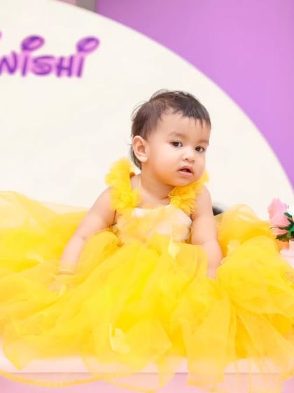 A thrilling 'Hot Wheels' themed birthday party, with checkered flags, car cutouts, and a custom racetrack backdrop, perfect for little speed enthusiasts.