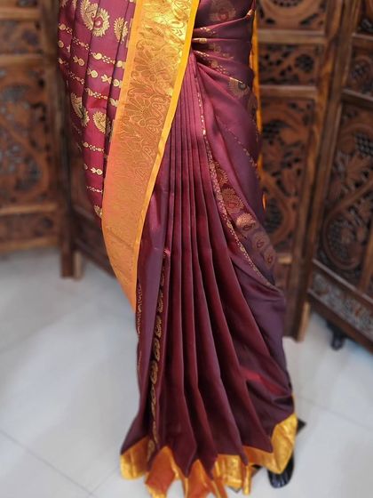 The finished drape on the mannequin, showing the clean lines of the center pleats. This is the standard of quality I teach in my workshops.