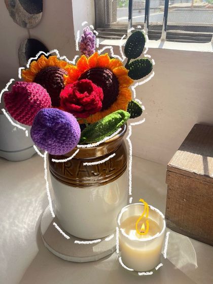 A creative way to display a crochet bouquet, placed in a traditional Indian pickle jar (barni).