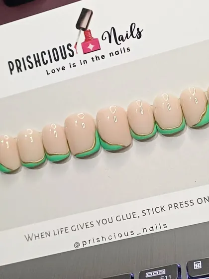 Another look at the green and gold abstract press-on nails. Each set is handmade and can be customized to your liking.