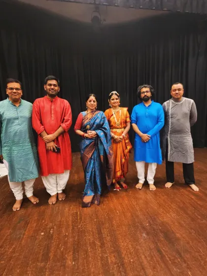 A group photograph with my disciple and the talented musicians. Supporting my students as they take the stage is one of the most fulfilling aspects of being a guru.