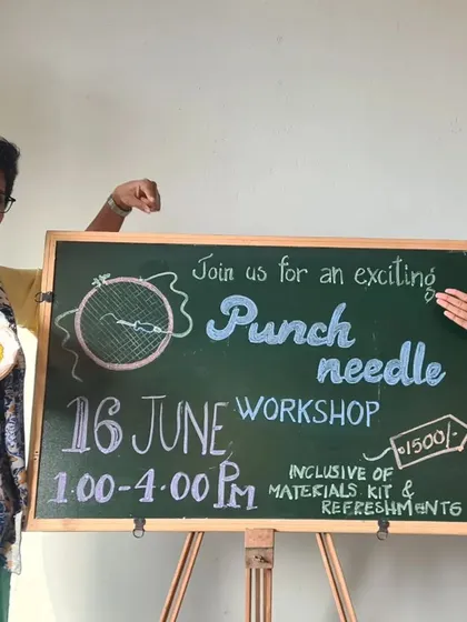 Announcing our workshop with two proud students showing off their new skills and finished art.