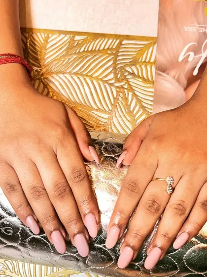 A simple and chic set of solid dusty rose gel nail extensions. This versatile color is perfect for an everyday look that is both professional and pretty.