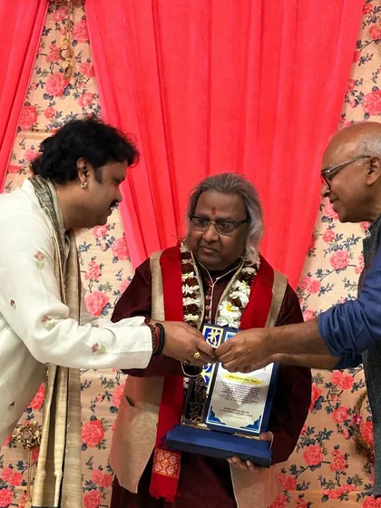 Another view of the felicitation ceremony, a gesture of respect within the musical community. These moments strengthen the bonds of our shared artistic heritage.