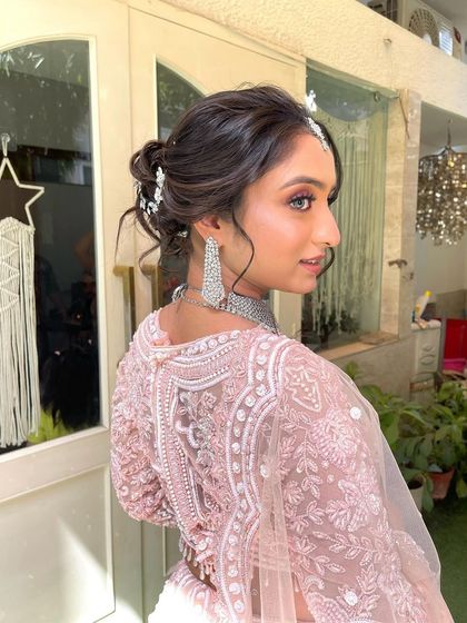 Another angle of the romantic updo, showing how the accessory is woven through the back for a touch of sparkle from every direction.