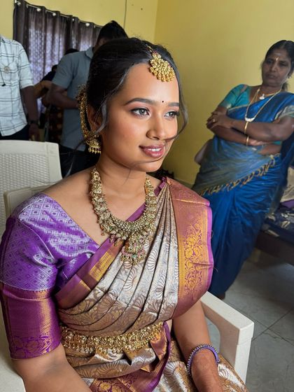Another angle of Swathy's engagement look, capturing her happy expression. The subtle makeup ensures she looks like herself, just with an extra touch of bridal glow.