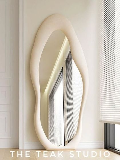 A full-length mirror can transform a room. We can craft this kind of large, free-form mirror with a sculptural frame to add an artistic and modern touch to your bedroom or dressing area.