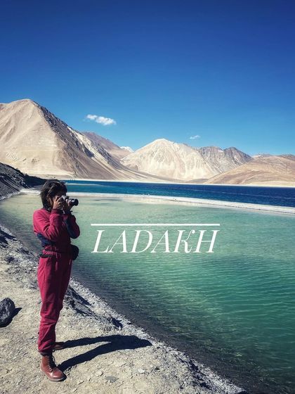 A traveler capturing the incredible blue of Pangong Lake. Our trips are full of moments like these, perfect for photographers and nature lovers.