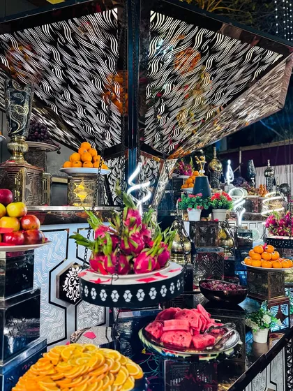 Another angle of the stunning fruit counter, showcasing the variety and artistic arrangement of the fresh produce.