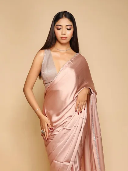 This image showcases the model's pose and the saree's elegant fall, captured with precise studio lighting.