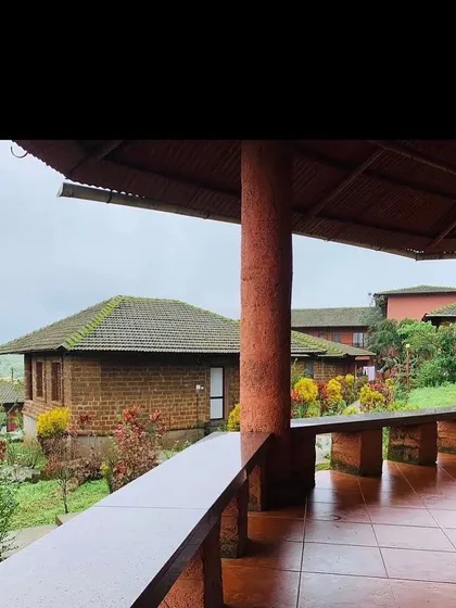A view of our ashram cottages in Amboli, nestled in the quiet hills of Maharashtra. This tranquil environment is designed for you to disconnect from worldly noise and reconnect with your inner self.