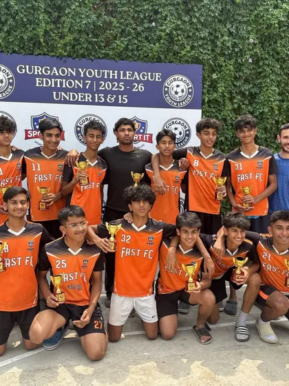 Our U15 champions posing with their trophies and coaches after winning the Gurgaon Youth League.