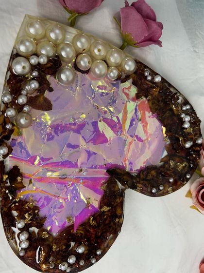 Another view of the holographic heart. The beautiful colors shift and change in the light, making this a truly unique and mesmerizing piece of resin art.