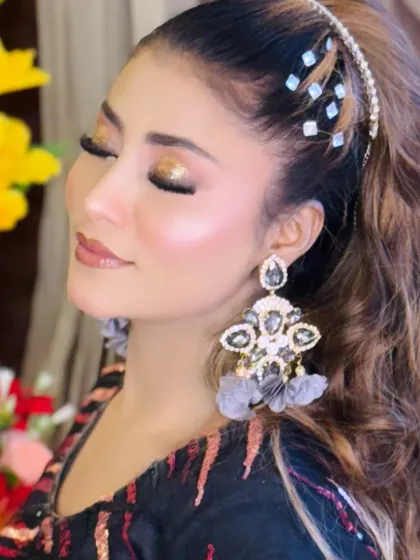 A close-up with eyes closed, showcasing the stunning glitter eyeshadow from a portfolio look.