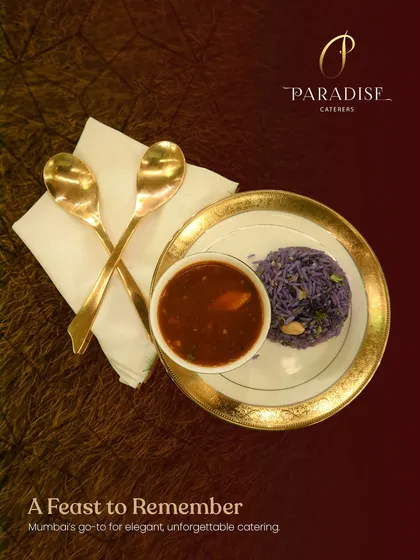 A feast to remember. This plate of purple rice and savory curry, served with golden spoons, represents the elegant and unforgettable catering we are known for.