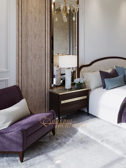 A luxurious bedroom with classic wall paneling, a grand chandelier, and rich purple accents, creating a regal and sophisticated atmosphere.