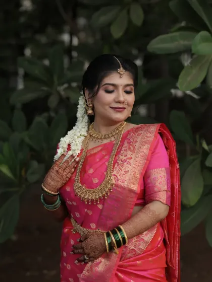 A close-up shot capturing the bride's serene expression and the details of her makeup.