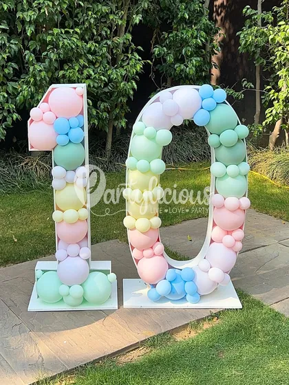 A double-digit birthday deserves a sweet celebration. This number '10' balloon mosaic is filled with a rainbow of pastel balloons, perfectly matching the ice cream and candy theme.